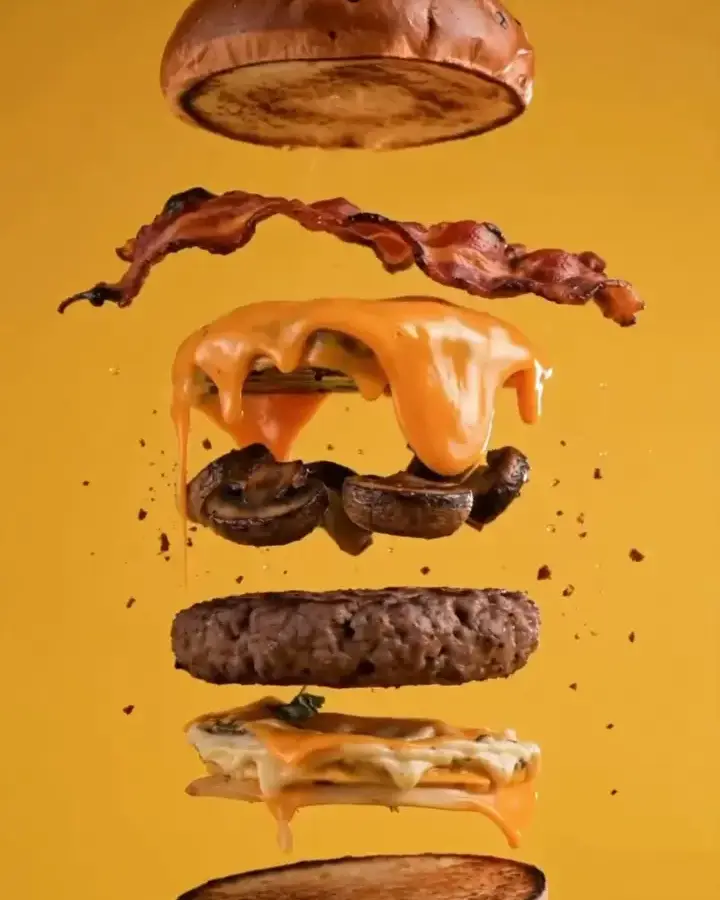 Bee burger layers: brioche, bacon, cheese, beef patty